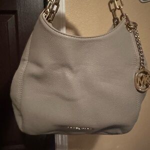 Michal kors, can be worn shoulder or crossbody.